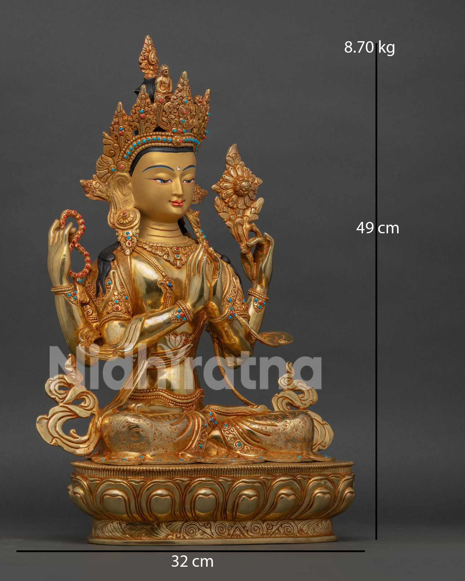 side view of four arm chenrezig statue seated on lotus throne buddhist art