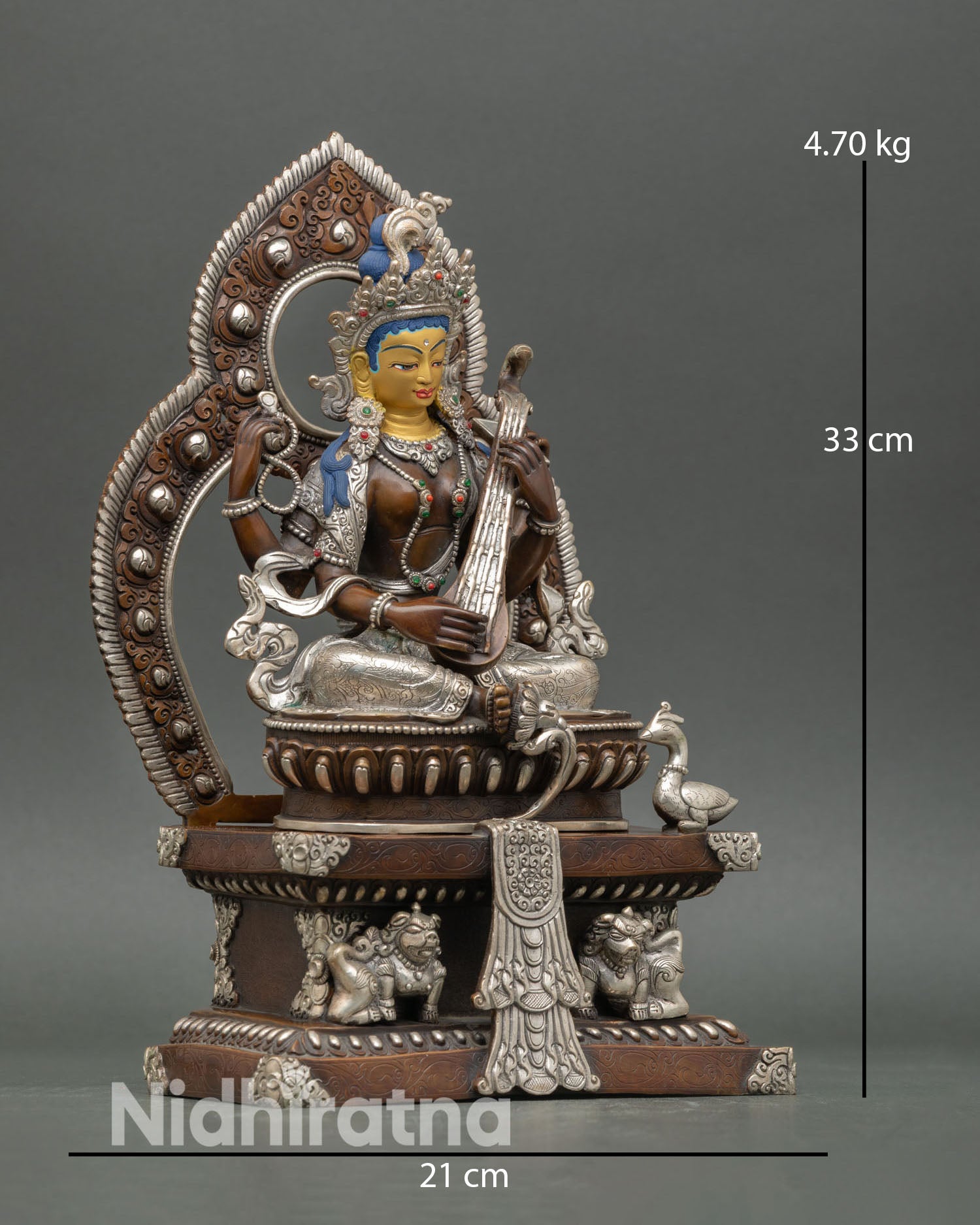 Side view of Goddess Saraswati statue holding vina in graceful posture symbolizing knowledge and continuous flow of divine inspiration