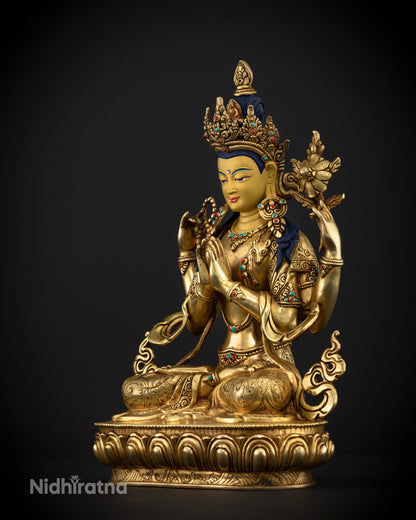 Side view of gold-gilded Chenrezig Avalokiteshvara statue showcasing a swirling robe, patterned garments, and intricate copper carvings.