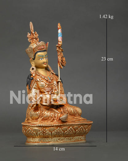 Side view of gold gilded Guru Rinpoche Buddhist statue with intricate Newari hand carved details