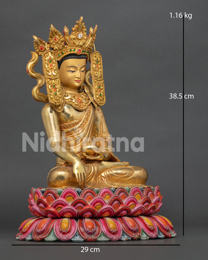 Side view of gold gilded Jowo Shakyamuni Buddha sculpture highlighting the detailed monk robe patterns and Himalayan metalwork.