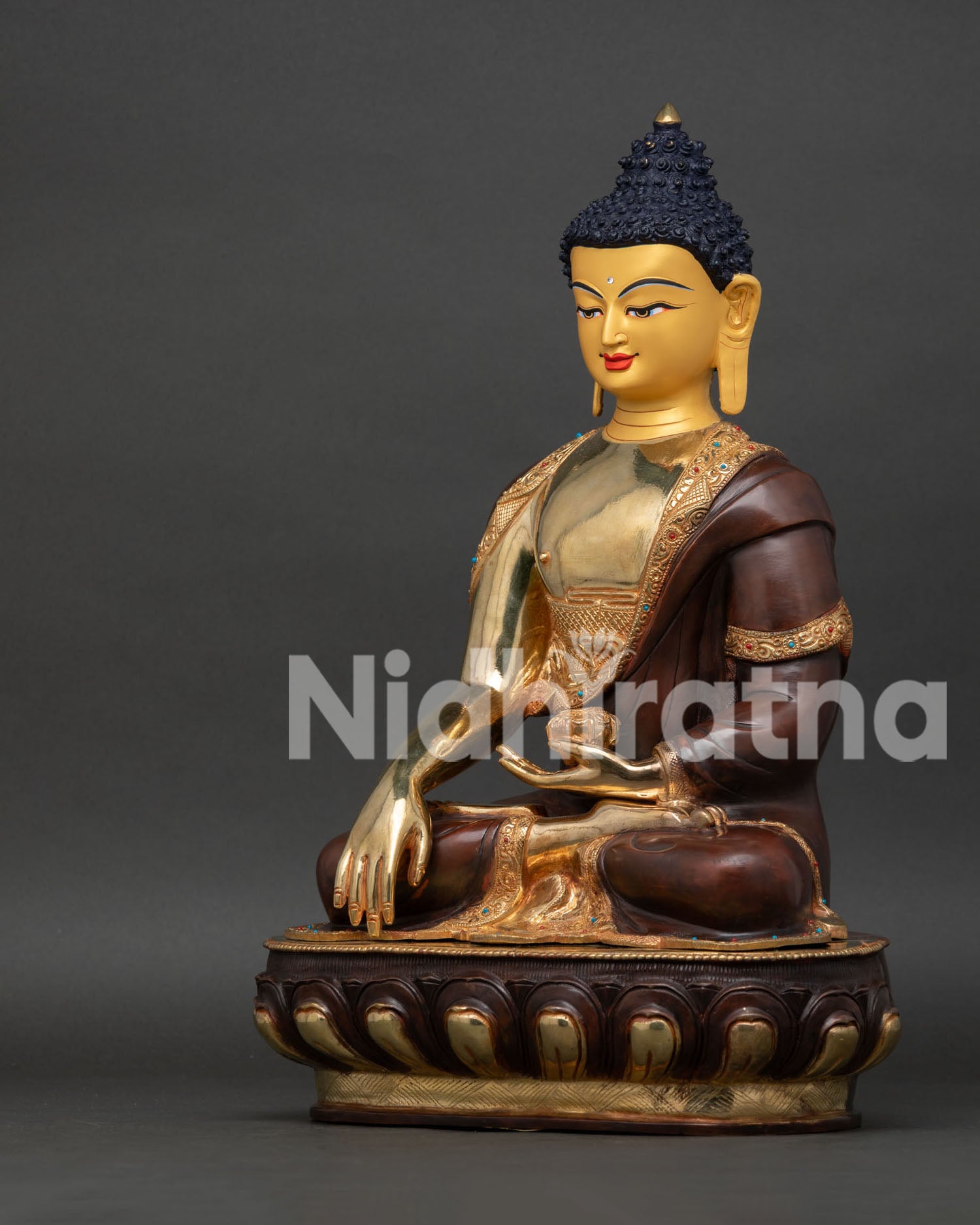Side View of Gold Gilded Shakyamuni Buddha Statue with Oxidized Monk Robe and Lotus Throne.