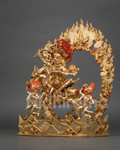 Side view of gold Palden Lhamo riding mule with attendants on carved mountain base