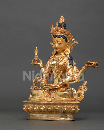 Side view of gold Prajnaparamita statue on lotus base, showing arms and crown, handmade in Nepal