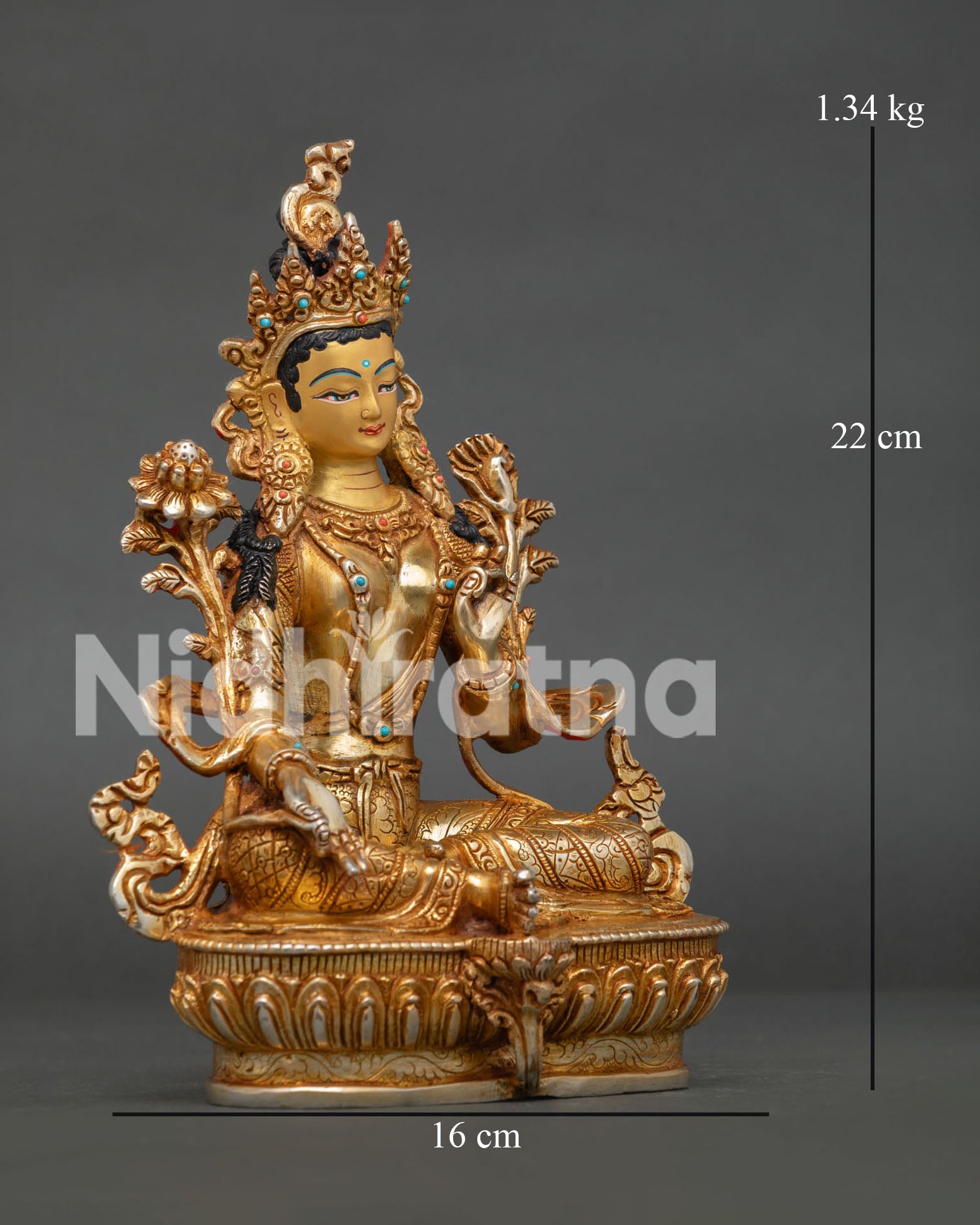Side view of Green Tara seated on lotus pedestal with right leg extended symbolizing compassion
