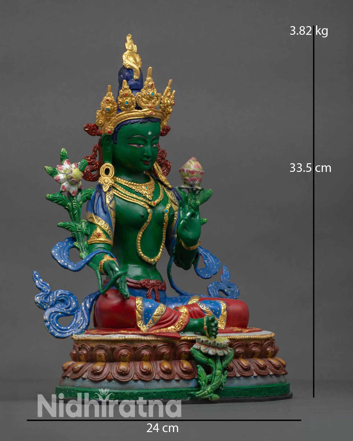 Side view of Green Tara statue revealing flowing adornments lotus seat and sacred Utpala flower held in hand.