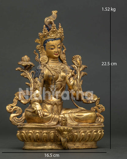 Side view of Green Tara statue seated on lotus pedestal in Nepalese Buddhist art