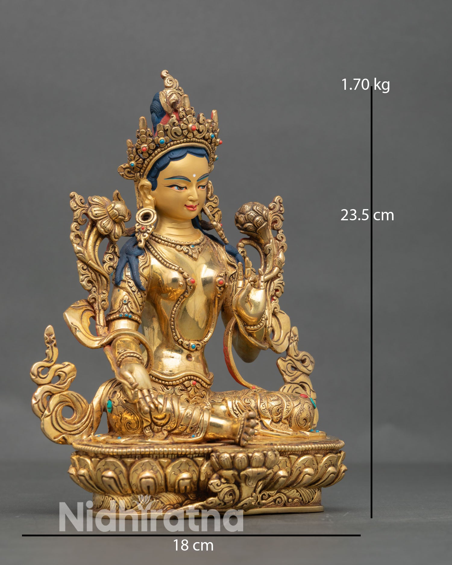 Side view of Green Tara statue seated on lotus throne with graceful hand gesture, symbolizing protection and swift liberation