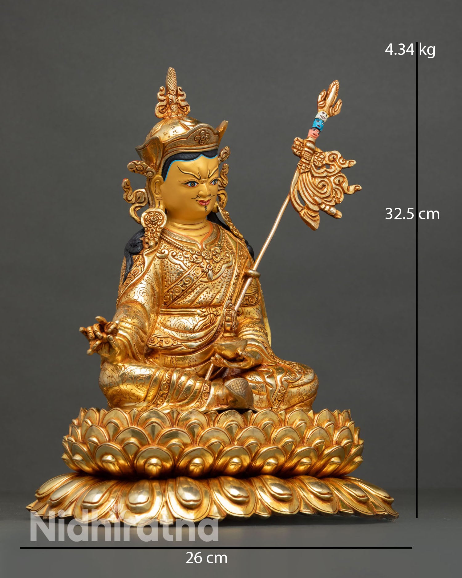 Side view of Guru Rinpoche statue showing commanding posture symbolic ornaments pure copper body and radiant gold gilded finish