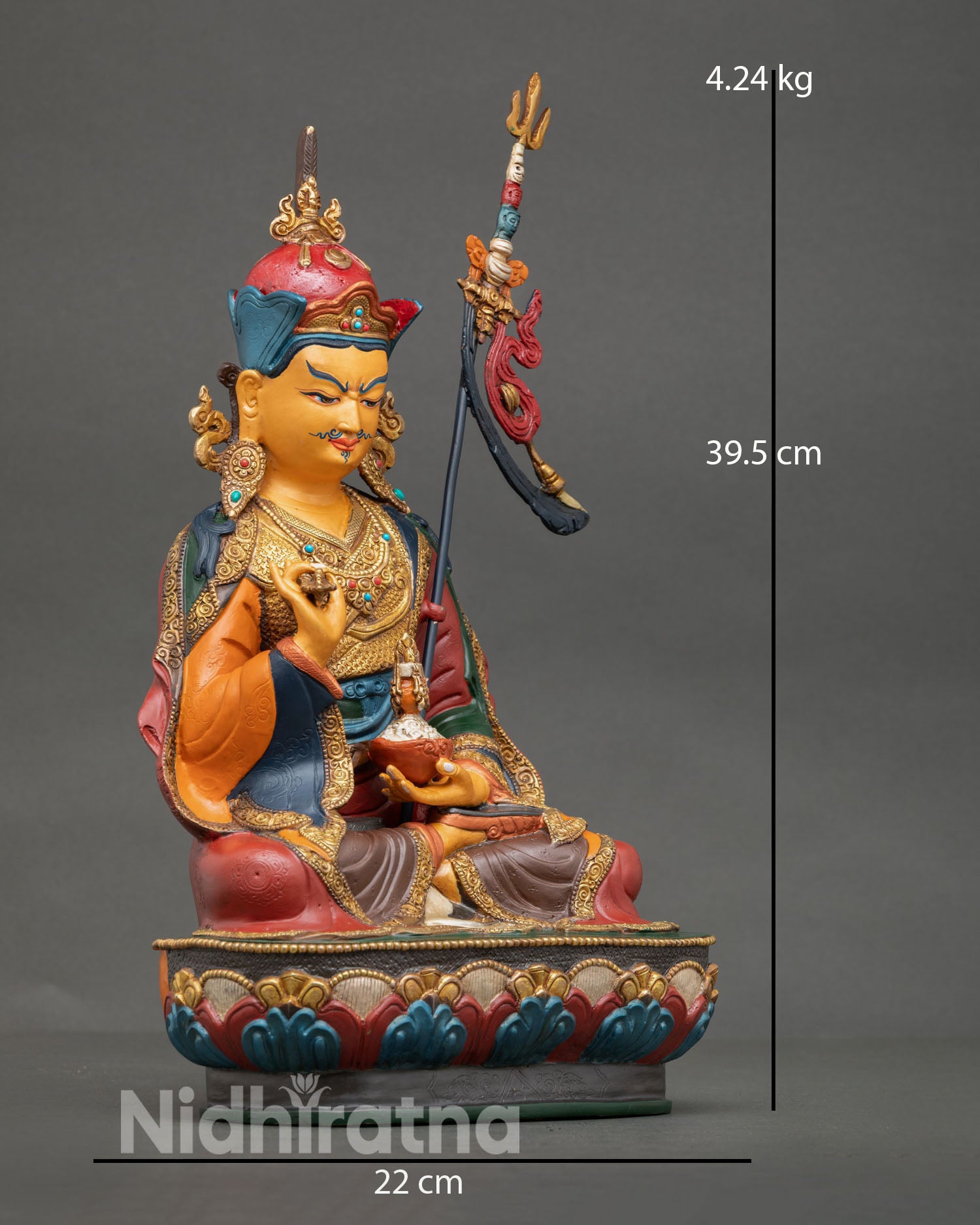 Side view of Guru Tsokye Dorje statue, lotus base, khatvanga staff, gold gilded copper art
