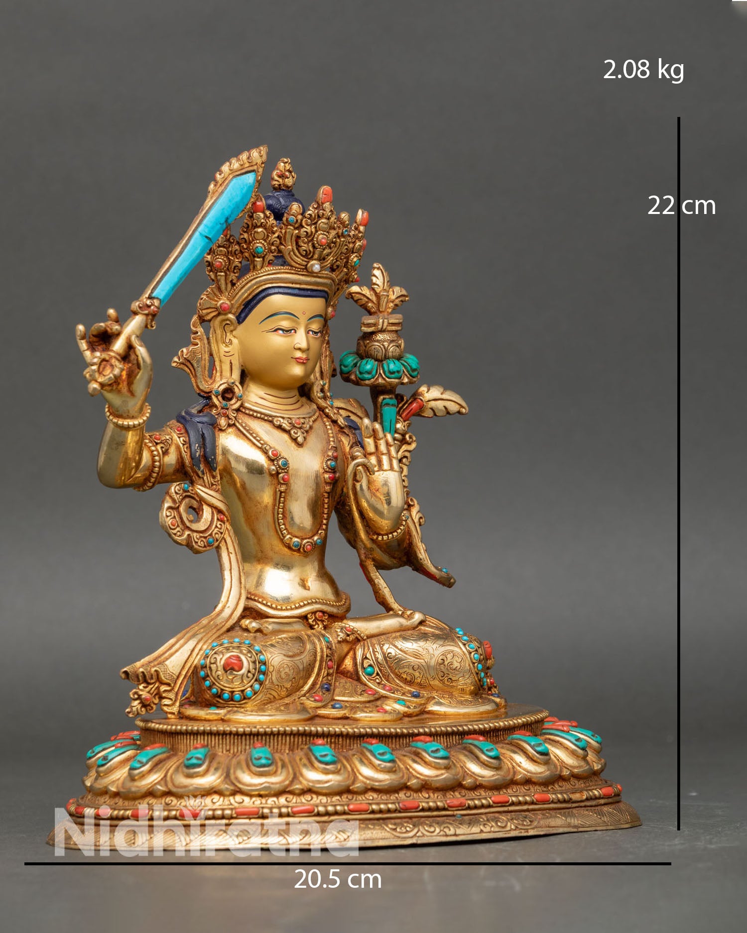 Side view of handcrafted manjushri sculpture nepalese craftsmanship lotus pedestal detailed robes