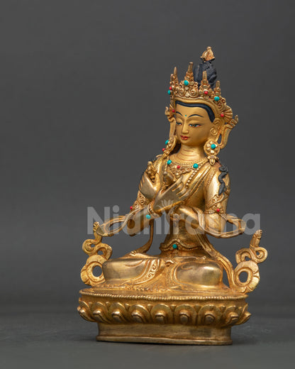 Side view of handcrafted vajradhara statue with carved lotus base and intricate nepalese metalwork.