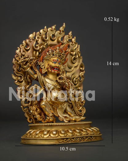 Side view of handcrafted Vajrapani sculpture standing, Surrounded by blazing flames