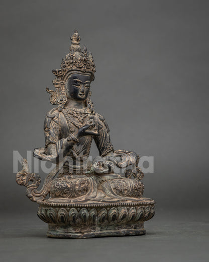 Side view of handmade Oxidized Copper Vajrasattva statue showing intricate crown and lotus base