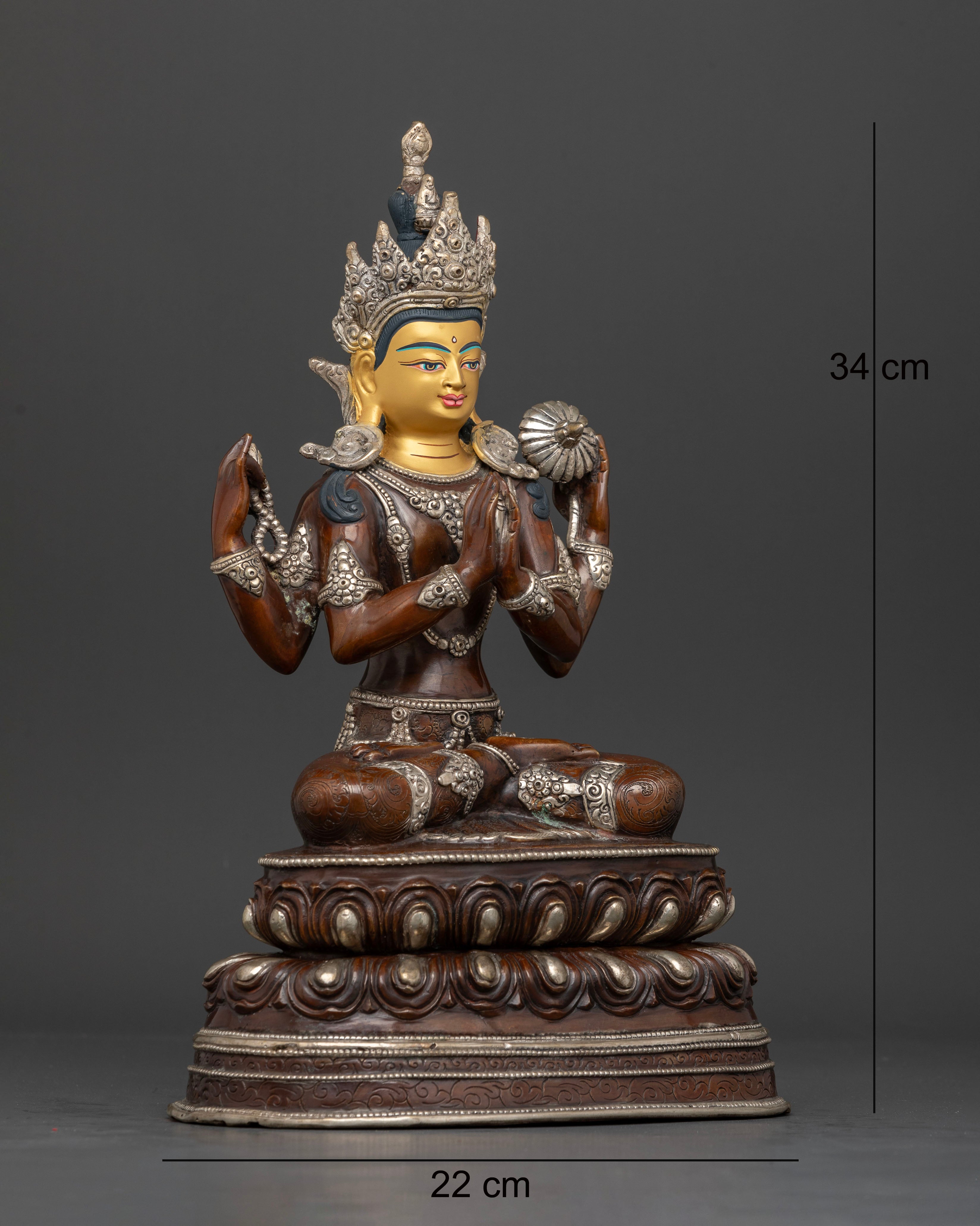 Side view of Himalayan Chenrezig statue holding sacred mala and lotus flower artwork