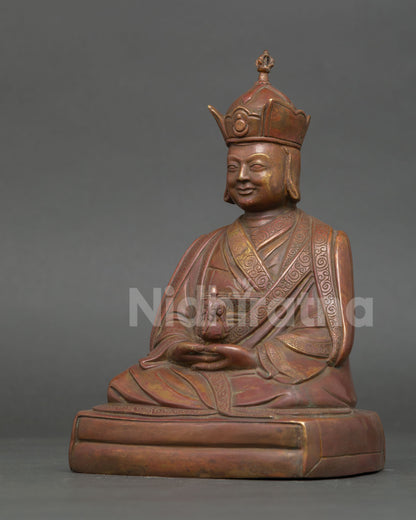 Side View of Karmapa Statue with Traditional Buddhist Robe and Pedestal Details