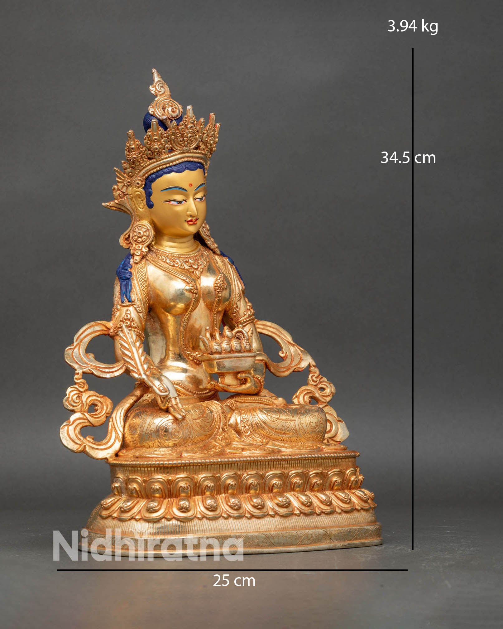 Close up of Kshitigarbha face gold painted details and intricate robe patterns