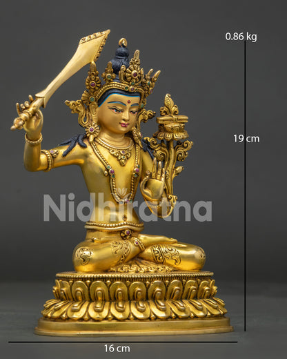 Side view of Manjushri Bodhisattva statue, showing flaming wisdom sword and lotus with scripture