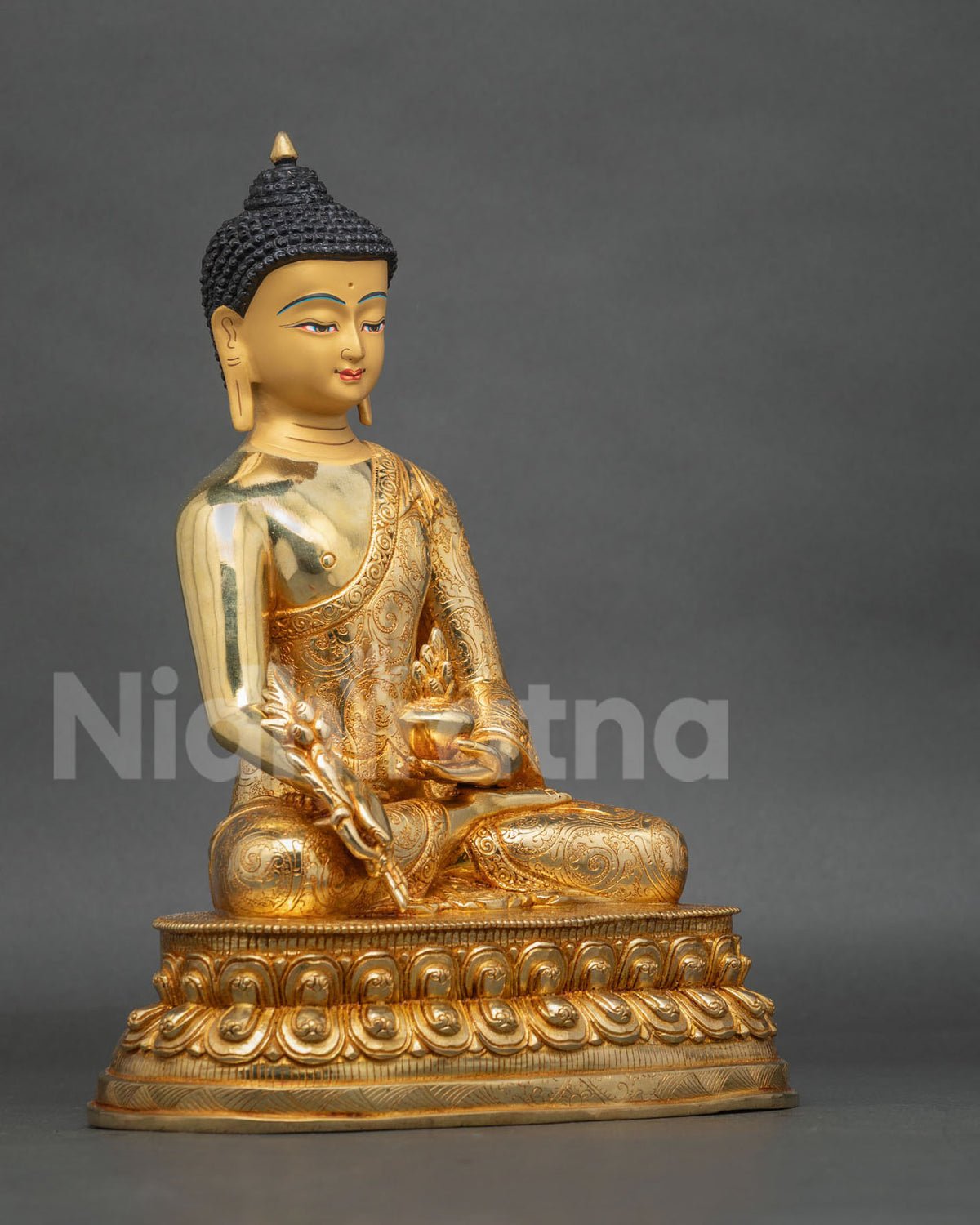 Side view of Medicine Buddha sculpture showing the myrobalan plant stem, nectar bowl, and intricate details of traditional Nepalese Buddhist artistry.
