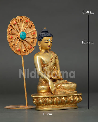 Side view of Mitrugpa Buddha statue seated in Earth Touching Mudra holding vajra with intricate robes