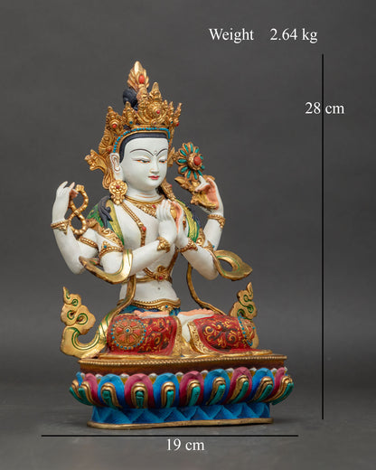 Side view of Nepalese copper Chenrezig Statue with gold details and lotus pedestal
