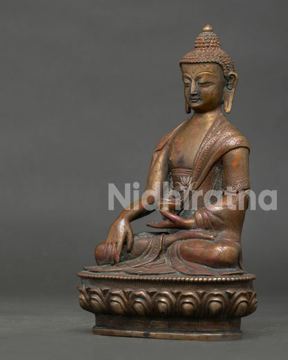 side view of oxidized copper buddha statue showing handcrafted details
