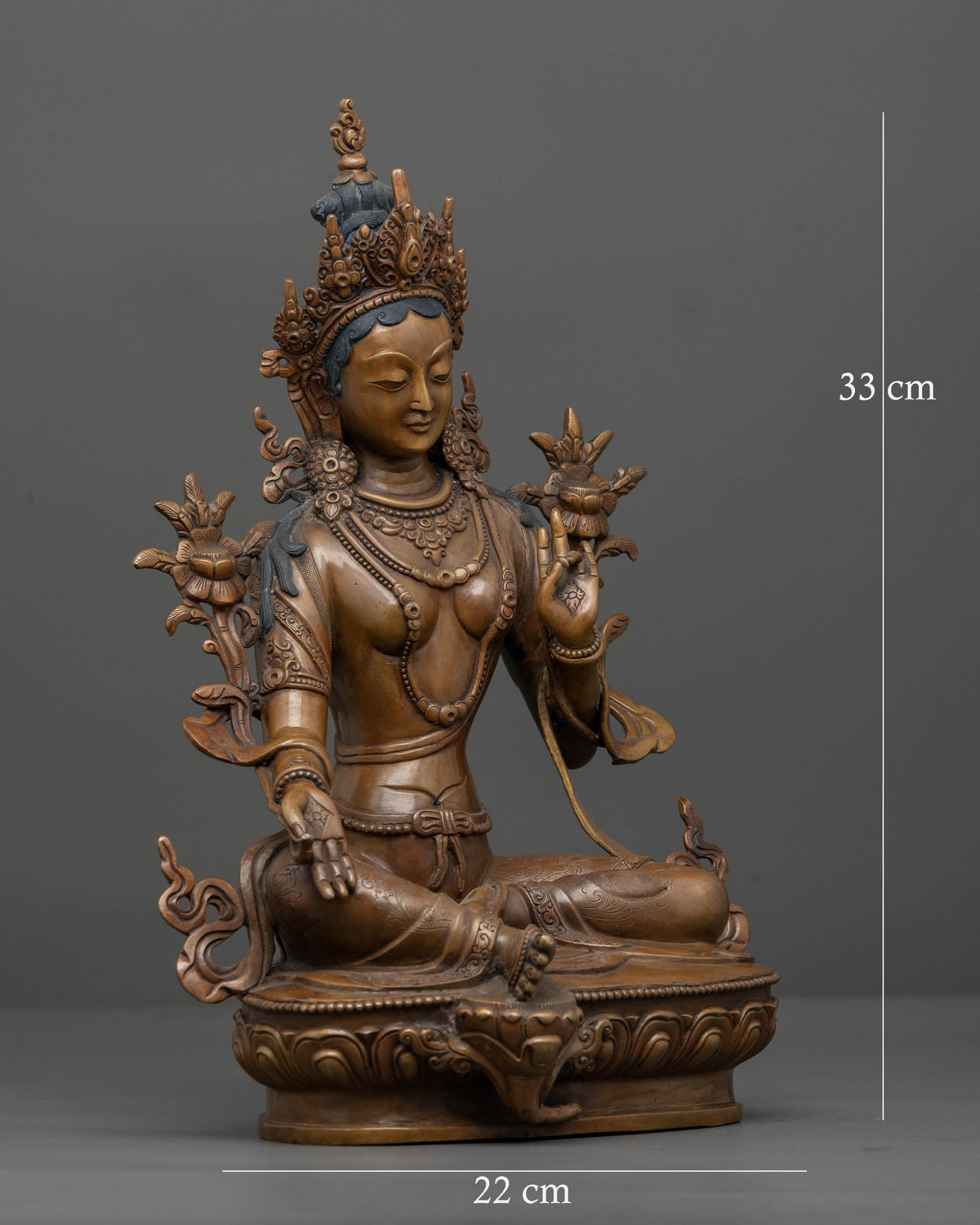Side view of oxidized copper Green Tara statue for Buddhist altar and meditation
