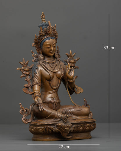 Side view of oxidized copper Green Tara statue for Buddhist altar and meditation