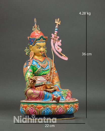 Side view of Padmasambhava statue seated on a lotus pedestal in meditation posture with 3D carved copper and hand-painted  finish