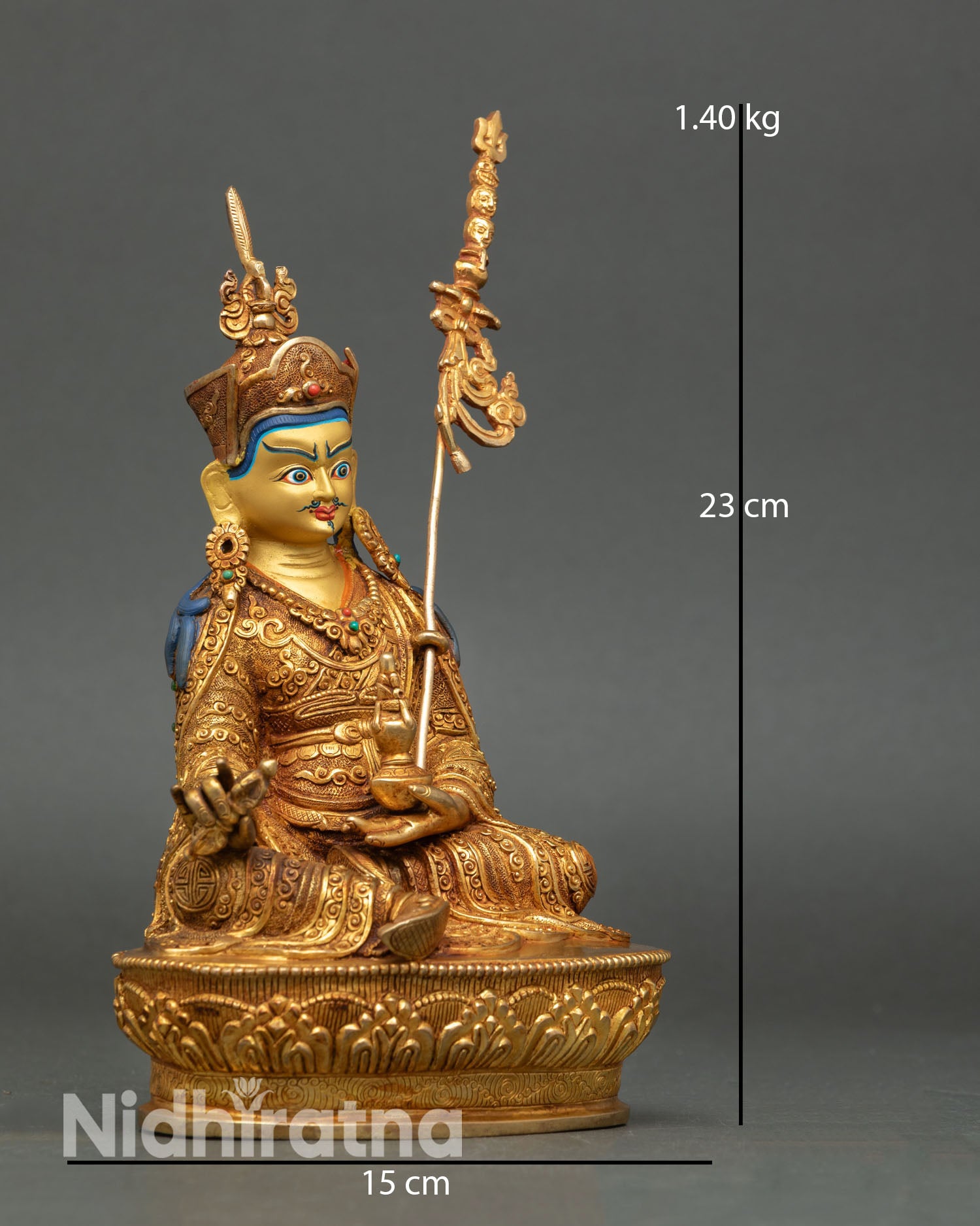 Side view of Padmasambhava statue with lost wax casting copper body radiant gold gilding and ornate spiritual detailing