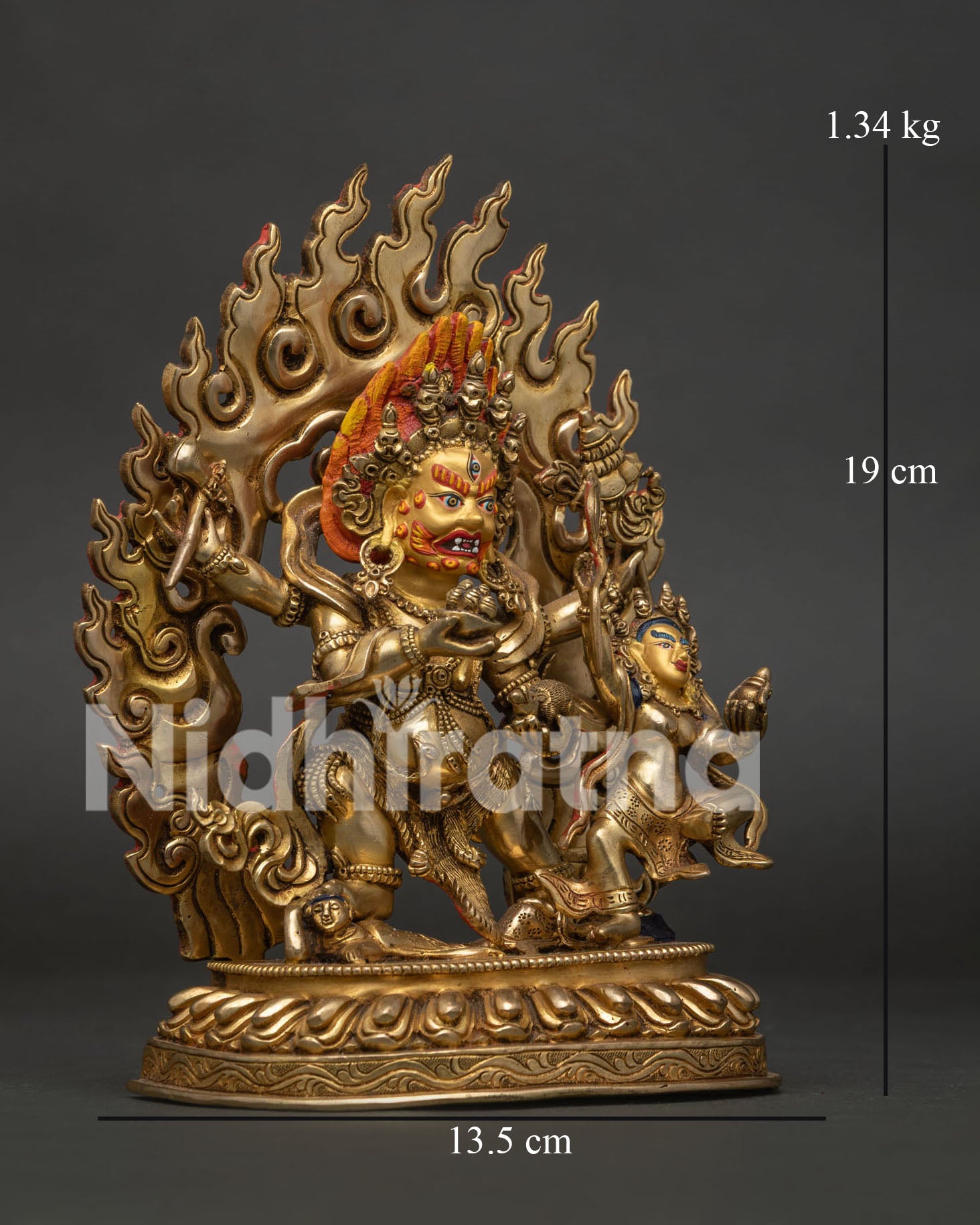 Side view of Red Dzambhala statue showing intricate Nepalese craftsmanship