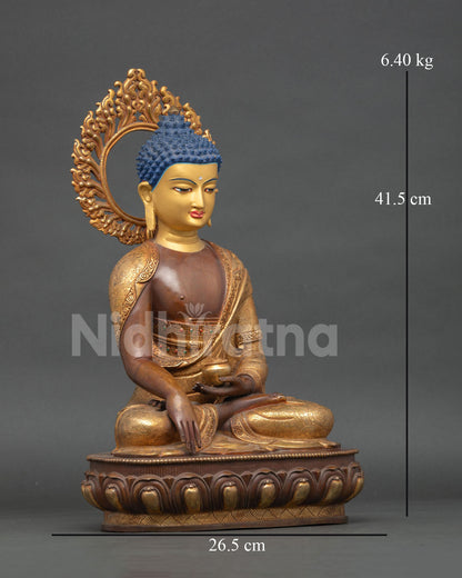 side view of seated buddha statue highlighting copper craftsmanship and gold accents on robes