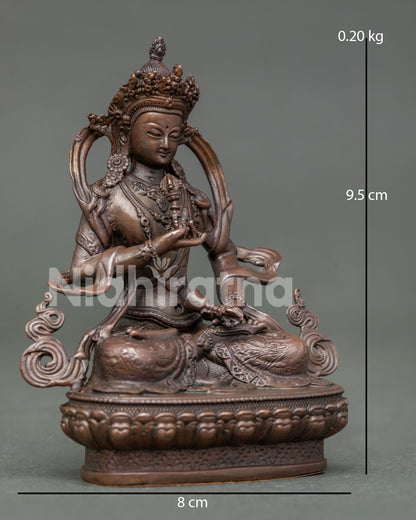 Side View of Seated Vajrasattva Statue Holding Vajra and Bell in Oxidized Copper
