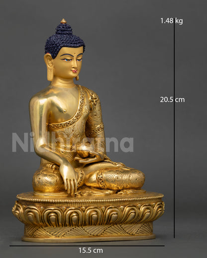 Side view of Shakyamuni Buddha showing monastic robe with floral motif detailing and copper body