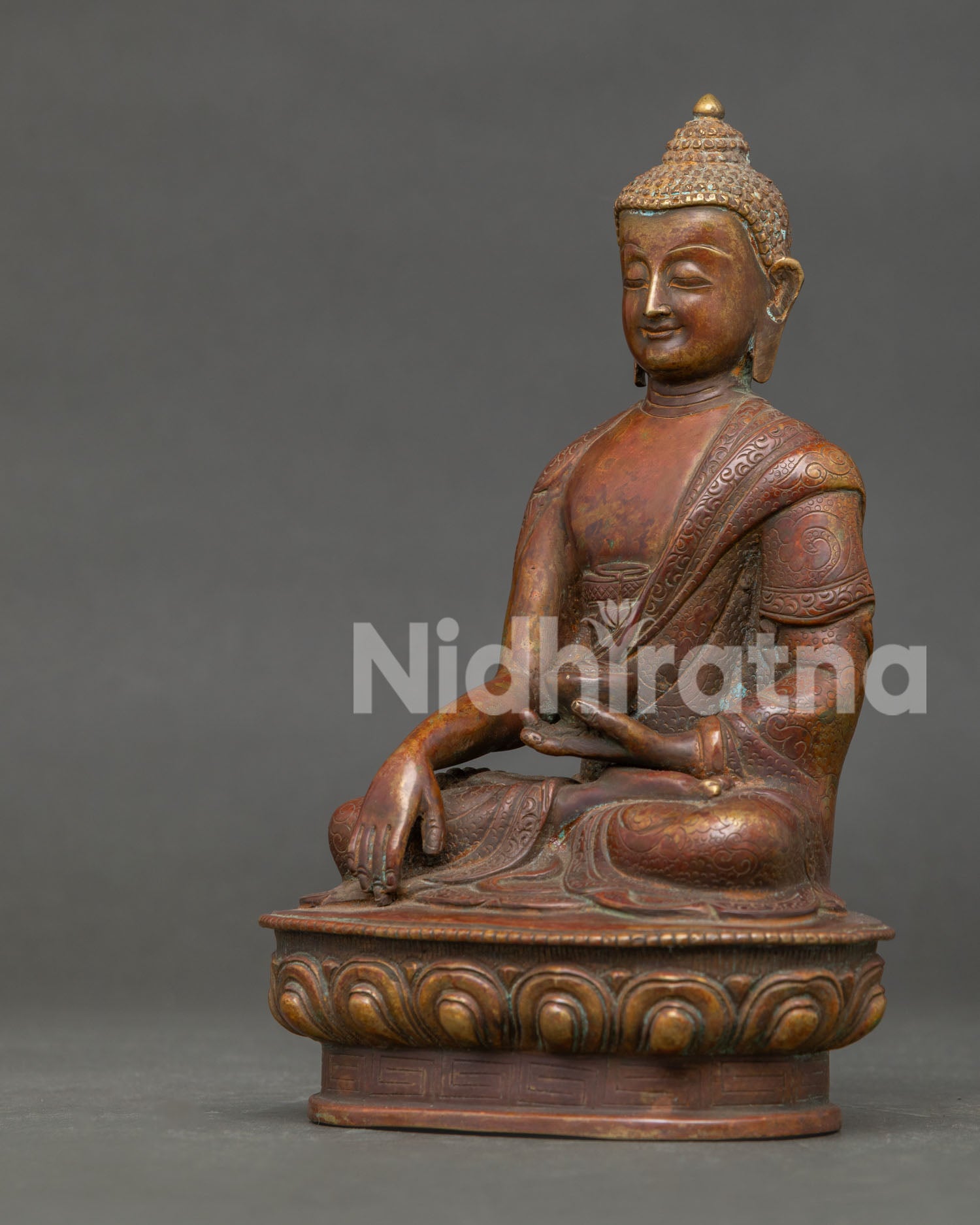Side View of Shakyamuni Buddha Statue in Bhumisparsha Mudra Holding Begging Bowl.