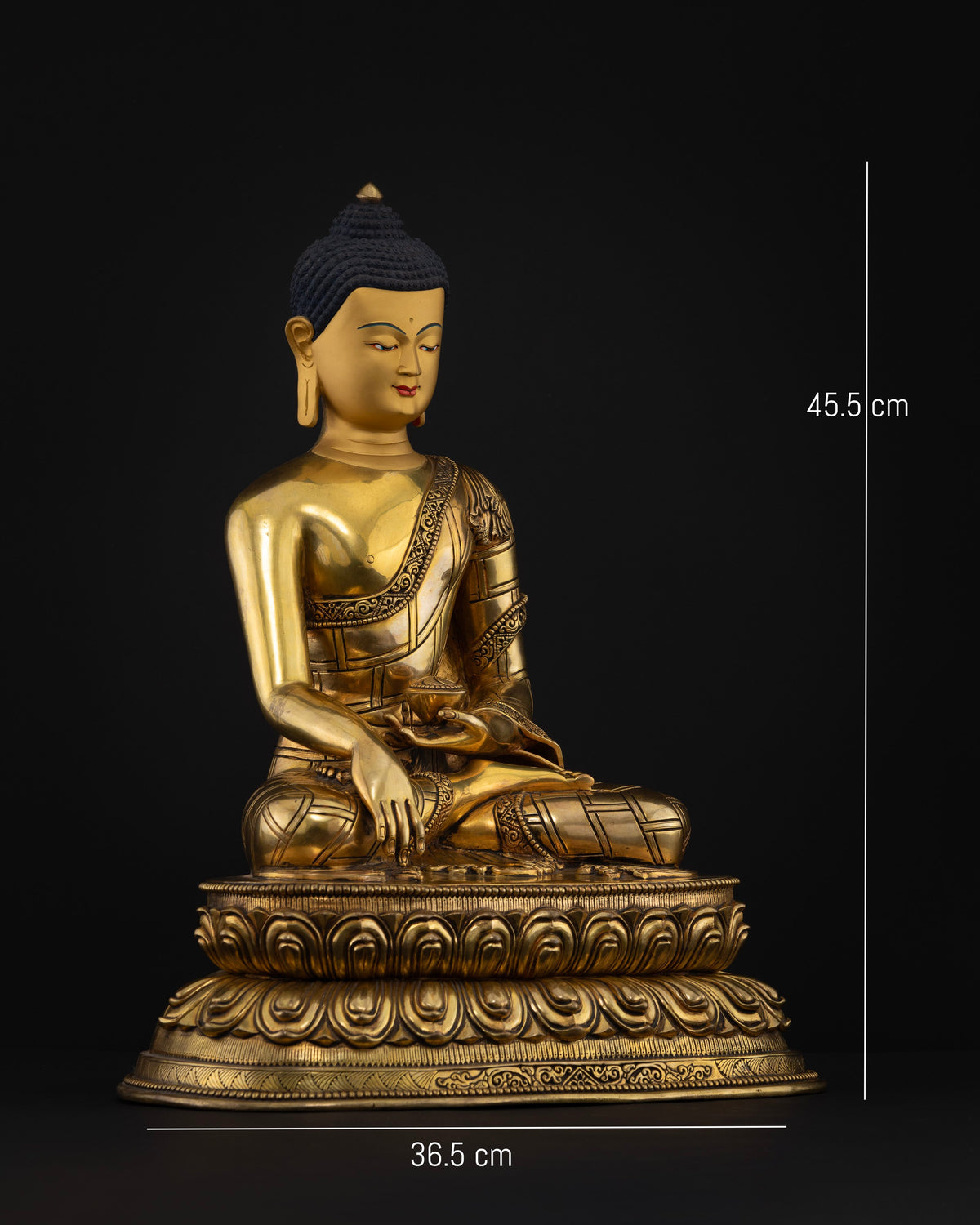 Side view of Shakyamuni Buddha statue showcasing intricate monastic robe carvings, earth-touching mudra, and sacred alms bowl