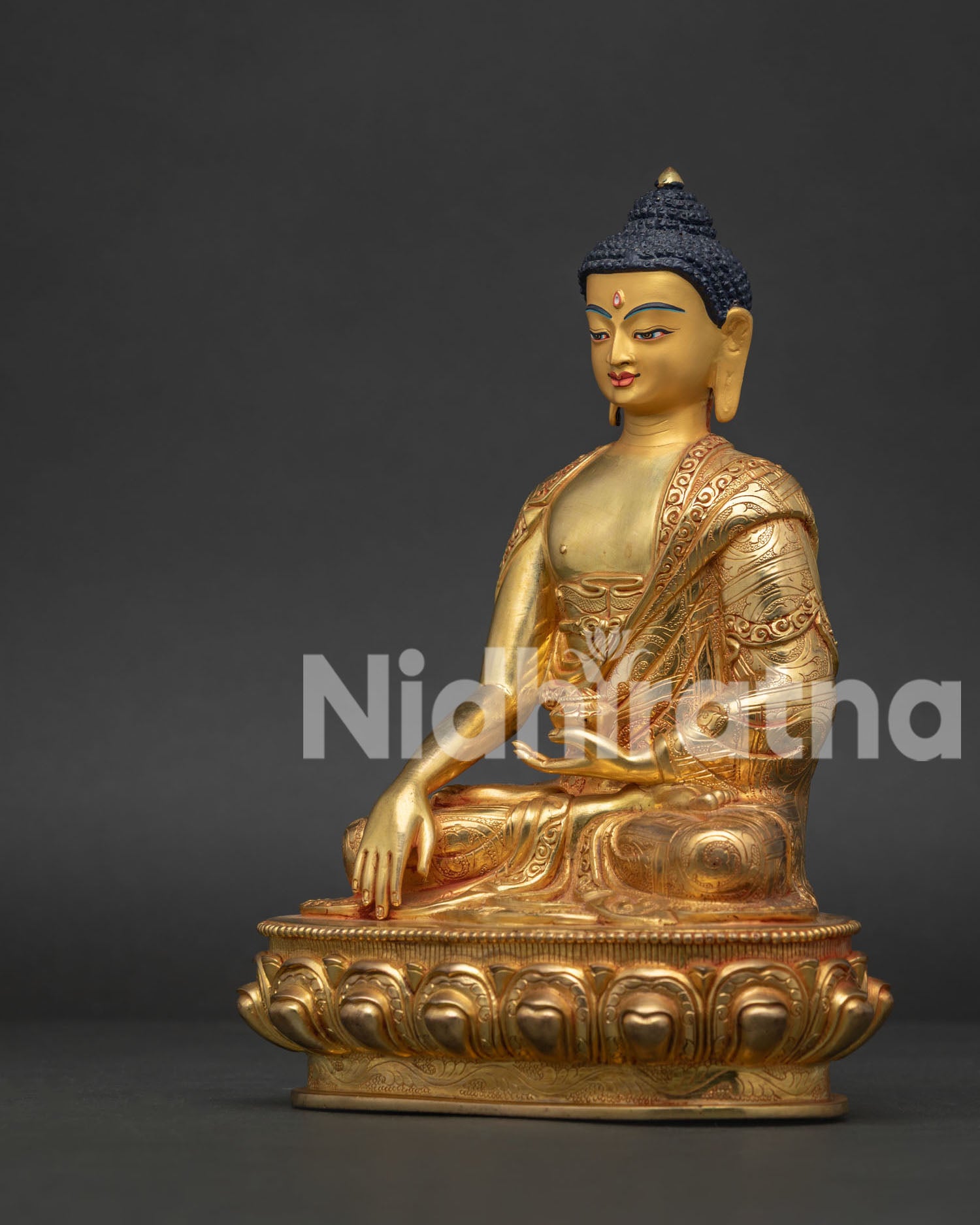 Side view of Shakyamuni Buddha statue showing Bhumisparsha Mudra and begging bowl.
