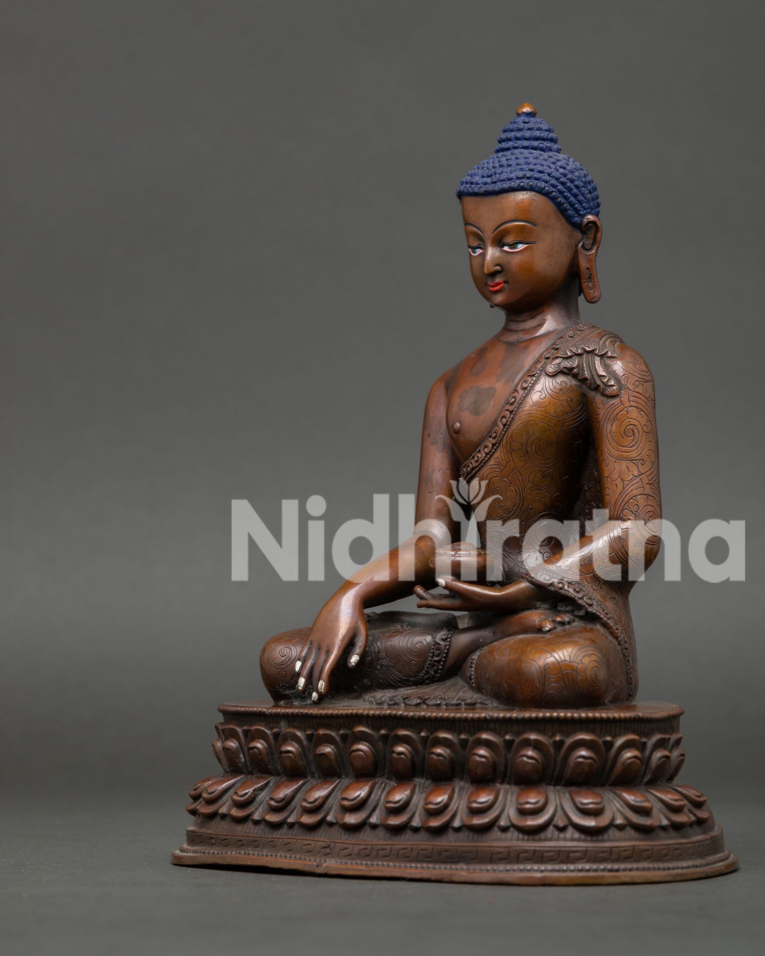 Side view of Shakyamuni Buddha statue showing dhyana mudra and traditional begging bowl on lotus pedestal.