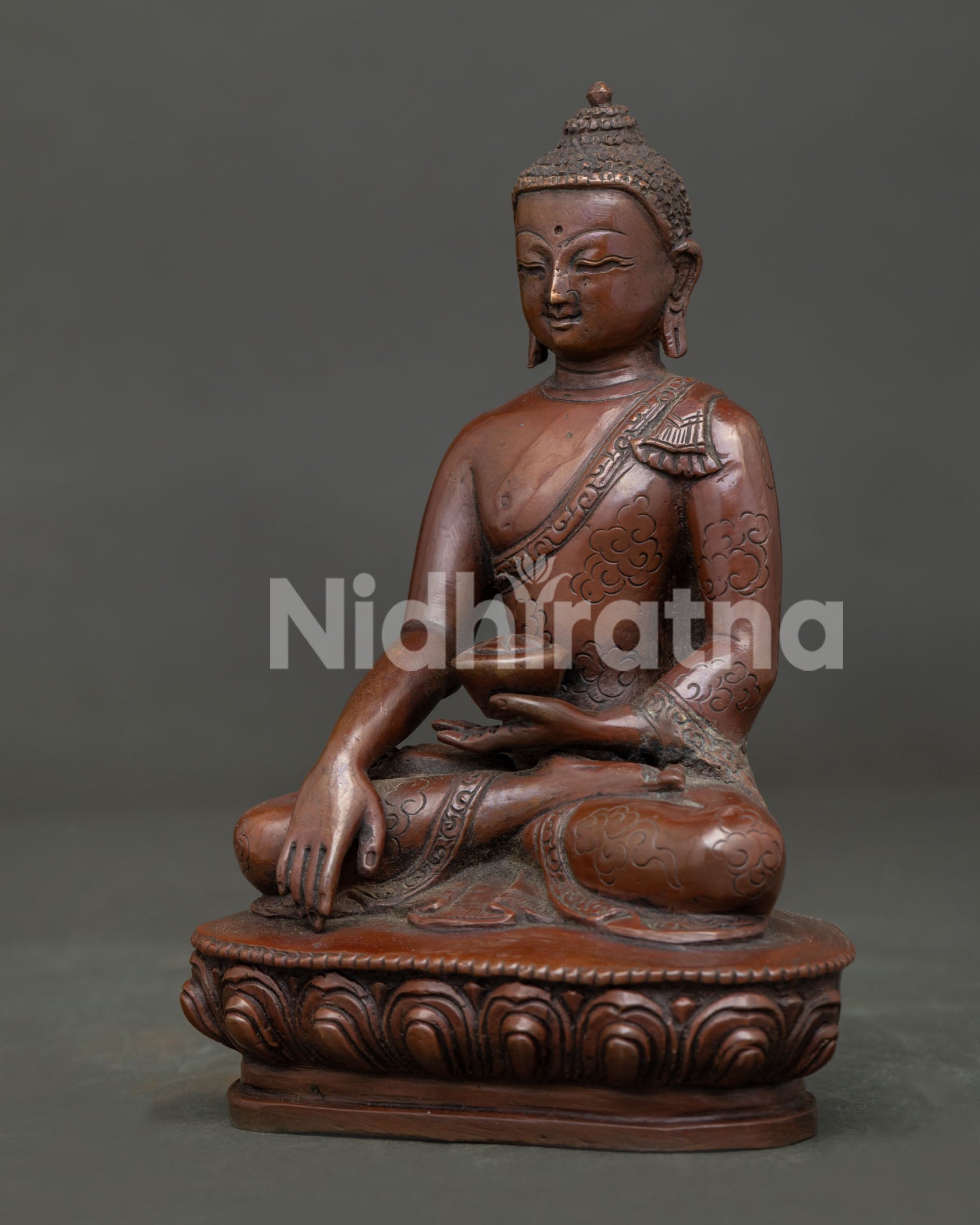 Side view of Shakyamuni Buddha Statue showing lotus pedestal and oxidized copper craftsmanship.