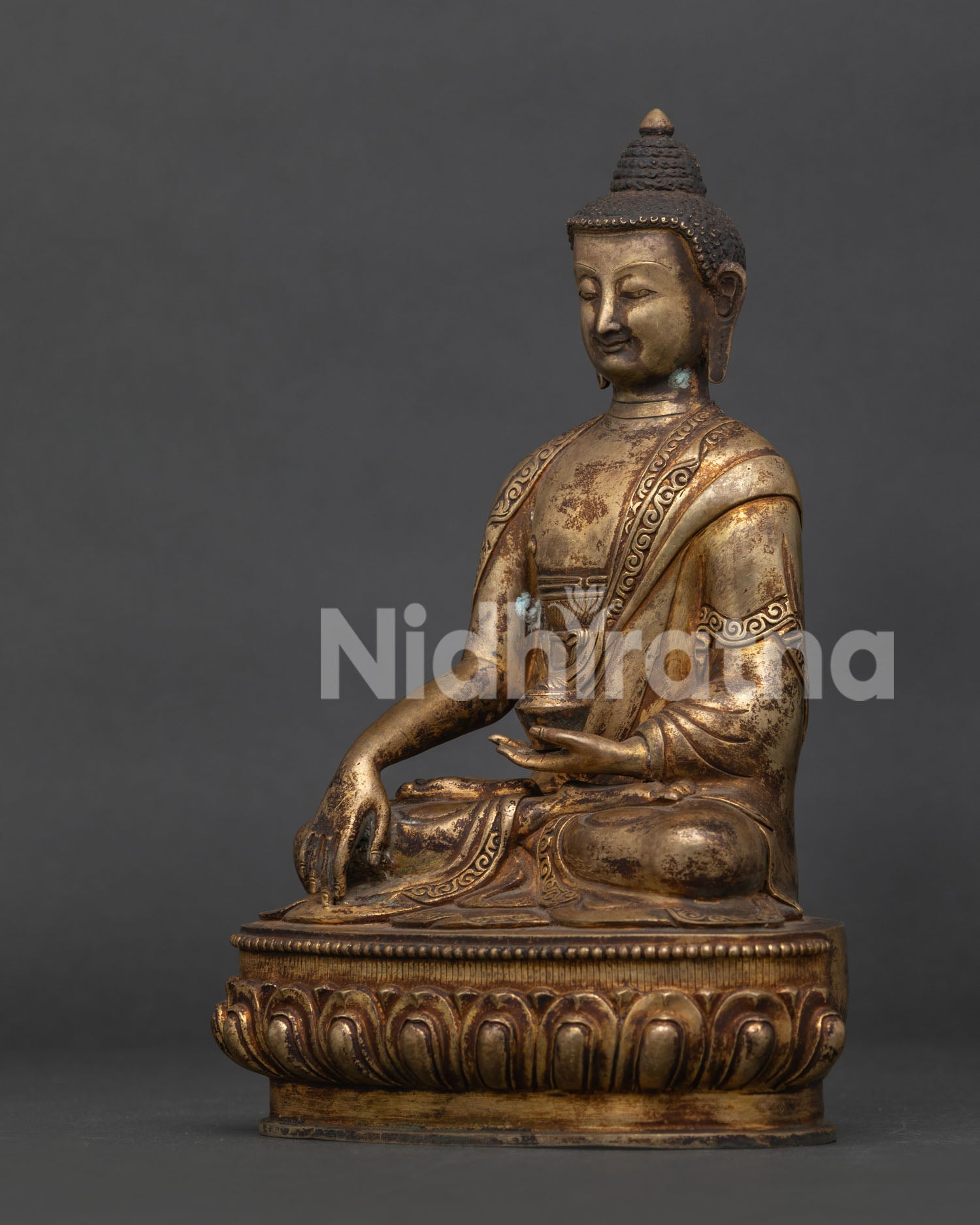 Side view of Shakyamuni Buddha Statue with hand-carved monk robe and lotus pedestal.