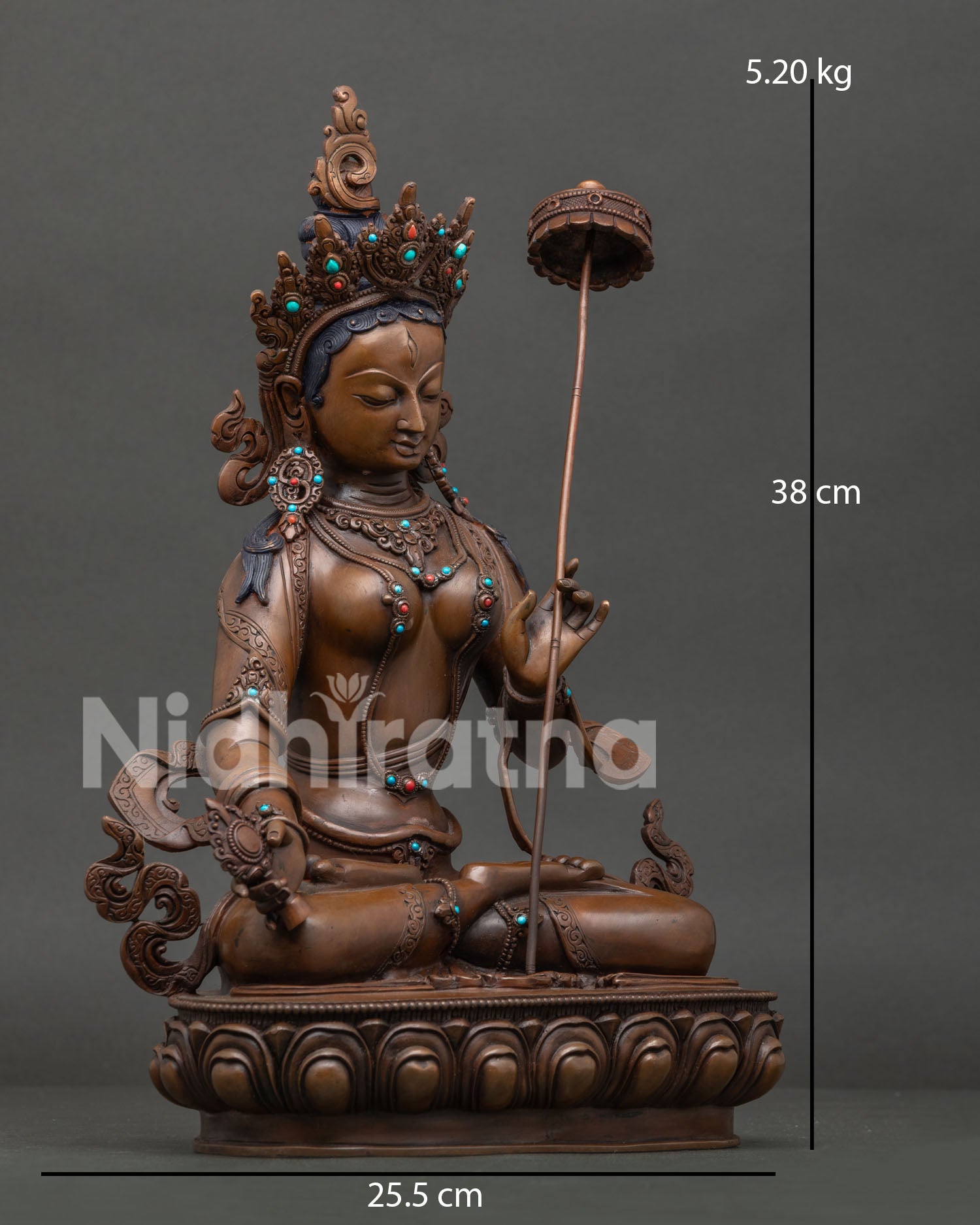 Side view of Sitatapatra White Umbrella Goddess statue seated on lotus pedestal