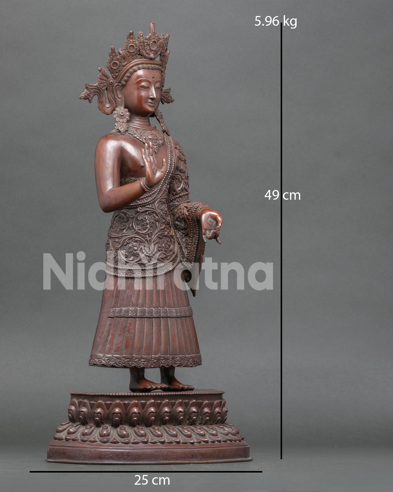 Side view of the handcrafted Dipankara Buddha sculpture displaying the Varada Mudra, Abhaya Mudra, and detailed oxidized copper finish.