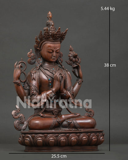 Side view of Tibetan Chenrezig statue holding crystal mala and utpala lotus flower