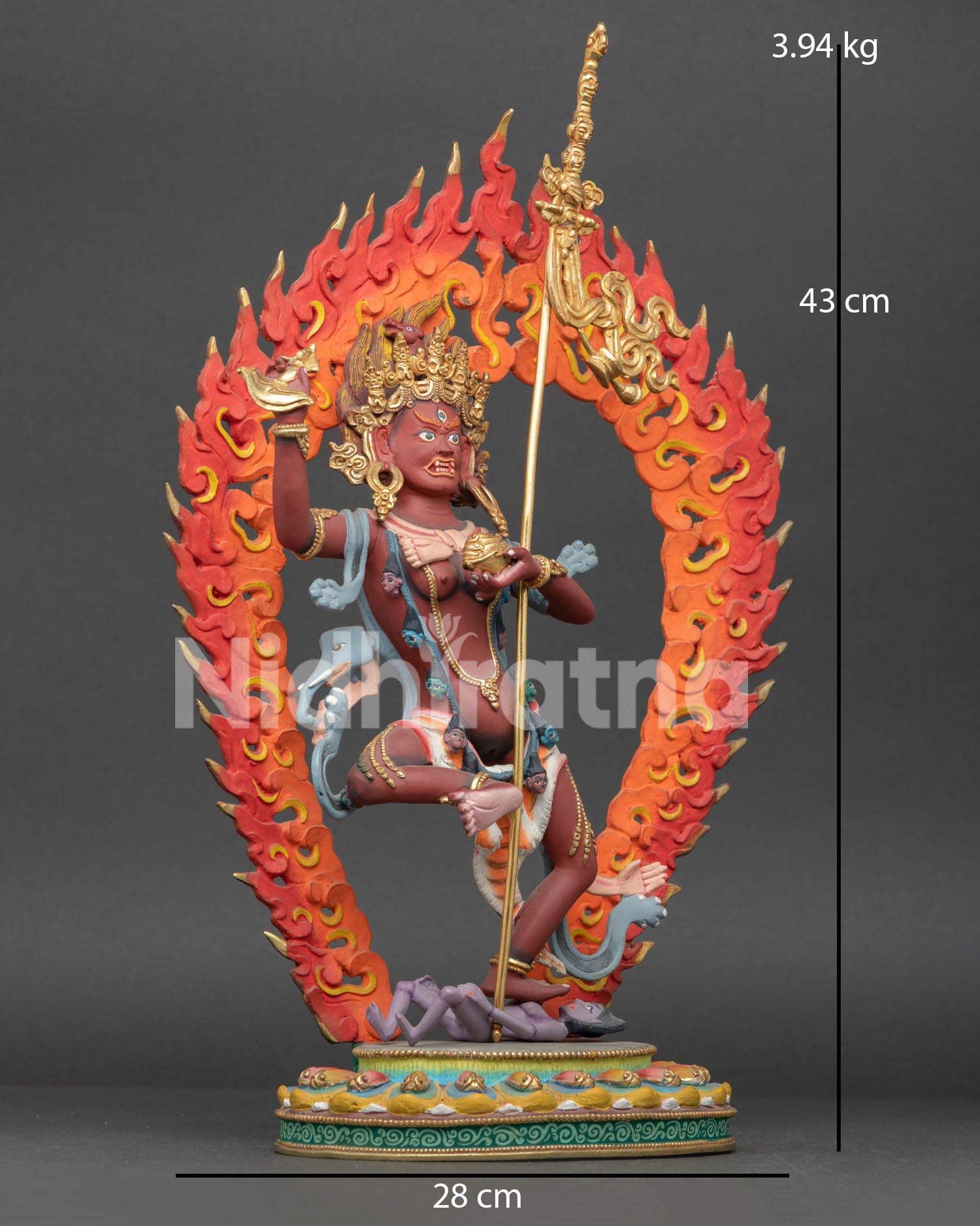 Side view of Troma Nagmo Vajrayana statue with khatvanga skull cup and elephant skin