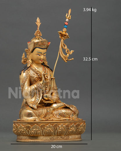Side view of Tsokye Dorje statue seated on blooming lotus holding dorje and skull cup representing wisdom transformation and protection