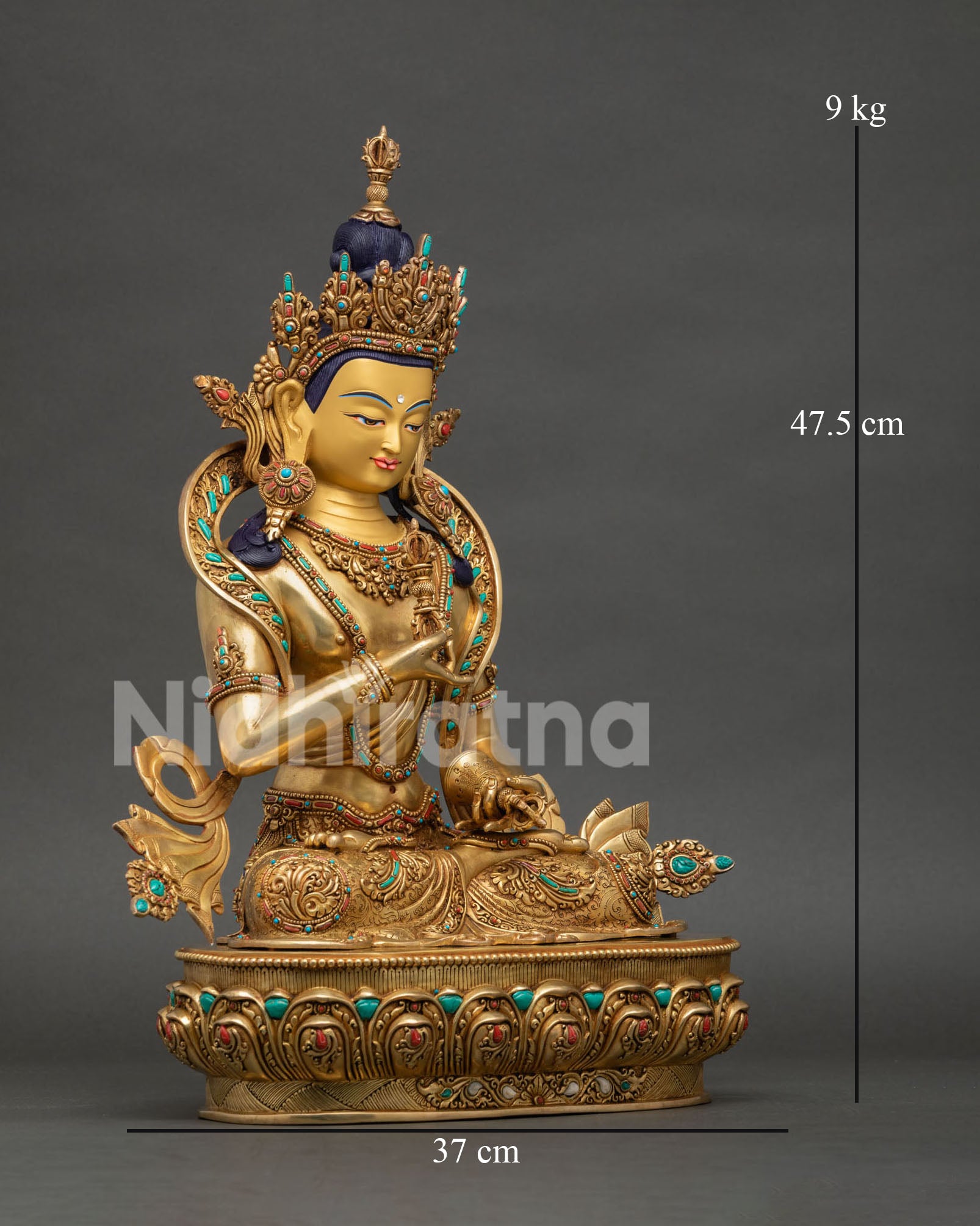 Side view of Vajrasattva Buddhist sculpture featuring copper body gold fire gilding and traditional Newari artistry