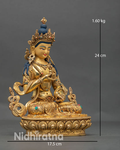 Side view of Vajrasattva Buddhist statue holding vajra and bell symbolizing karma purification, wisdom and compassion in Himalayan art style