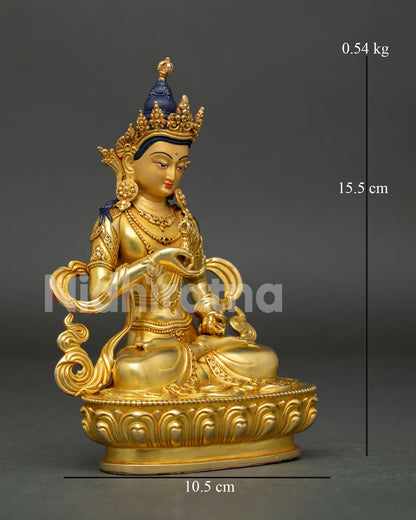 Side view of Vajrasattva sculpture seated on lotus pedestal with gold finish