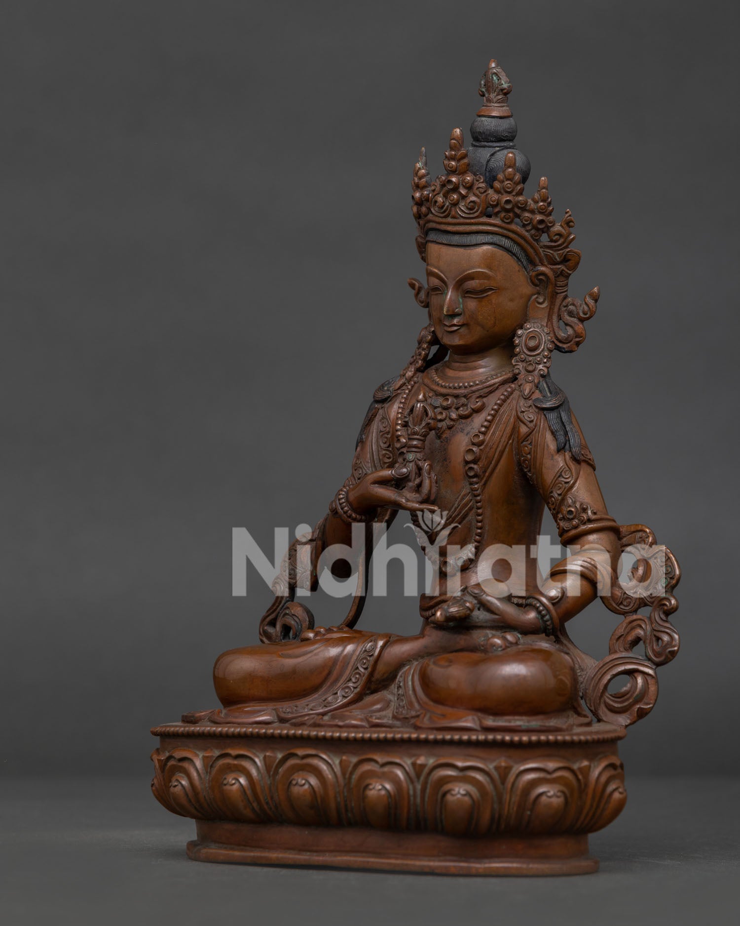 Side View of Vajrasattva Statue on Lotus Pedestal with Oxidized Finish.