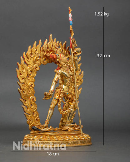 Side view of Vajrayogini on lotus seat with halo of flames, turquoise, and coral.